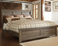 Juararo King Panel Bed with Mirrored Dresser, Chest and Nightstand